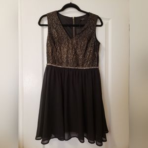 Black and gold medium short dress
